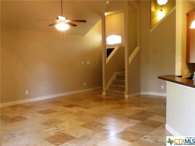 Travertine that invites! Entire lower half of home is very appealing!