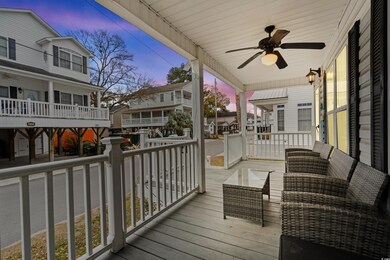 Deck at dusk with covered porch and ceiling fan
