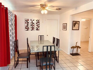 Breakfast opens to living room .