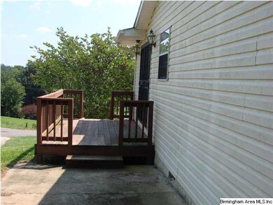 Right side, with deck and entry into house