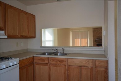 Kitchen looks into Family/Dining Room