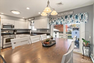 Dining Room Opens to Kitchen. Sliders to Paver Patio and Rear Yard!