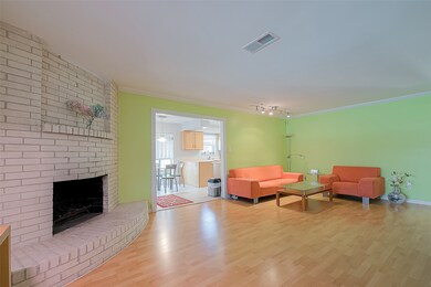 Large living space features a curved fireplace