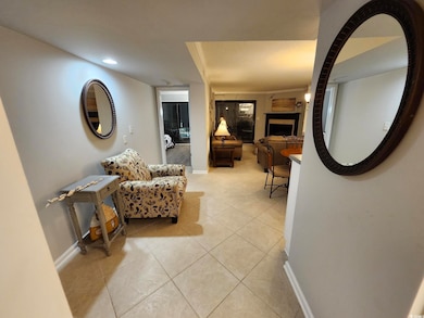 Hall with light tile patterned floors