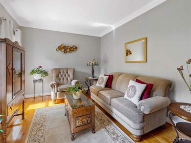 Formal Living Room with Hardwood Floors and Crown