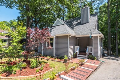 Attractive front yard leads to porch and front door.