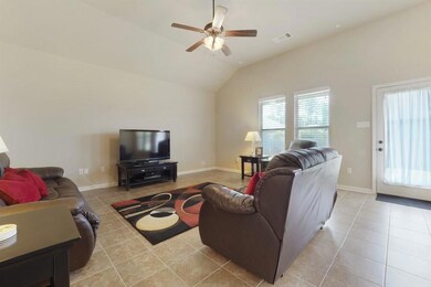 Living area boasting high ceiling, NO CARPET here!