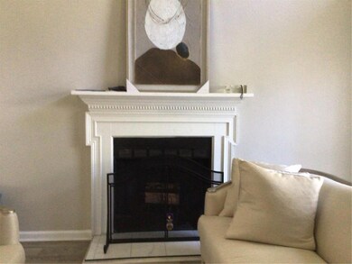 Interior details featuring a fireplace and baseboa