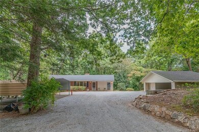 Private gravel driveway leading up to the home