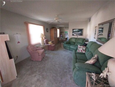 Living room is located between the patio and the d