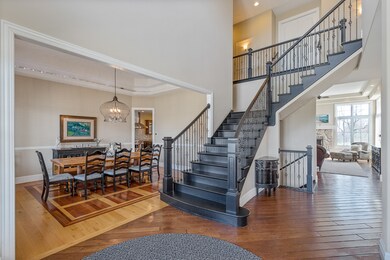 Two Story Foyer. 8' Arched top double door with be