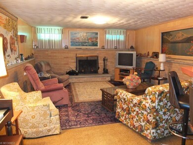 Lower level family room with fireplace and wet bar