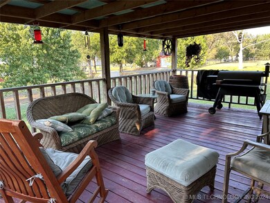 Covered back porch.  Great place to BQ or just rel