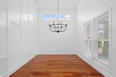The dining room features floor-to-ceiling judges p