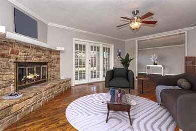 Living room featuring dark wood-type flooring, a f