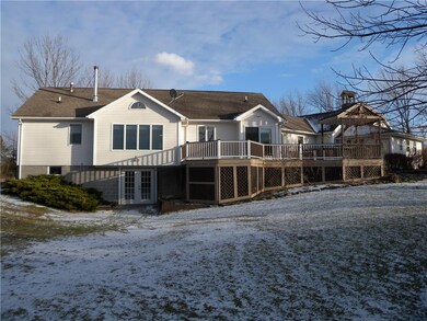 The back of the home shows the walk out basement a