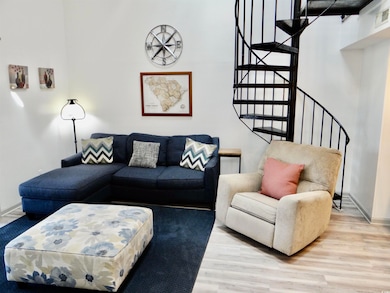 Living room featuring light LVP floors