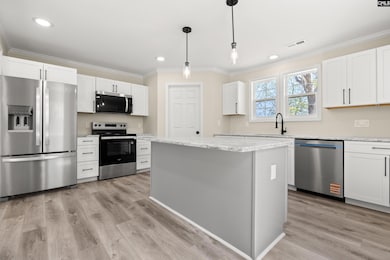 Full overlay cabinetry, granite countertops, stain
