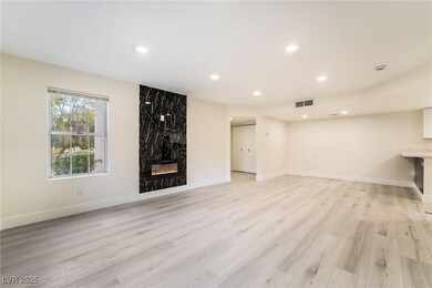 Unfurnished living room featuring visible vents, r