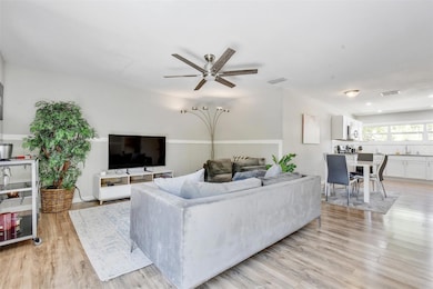 Living area featuring light wood-style floors, vi
