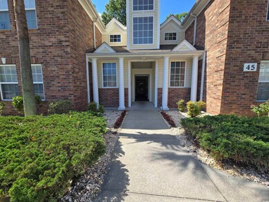 Property entrance with brick siding