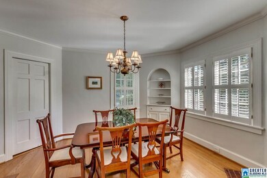 showing warm hardwood floors and door in left of p