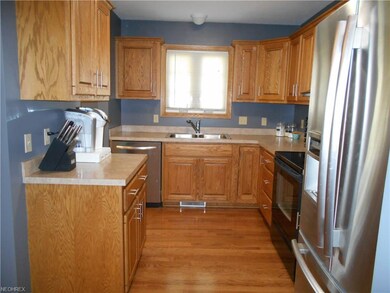 Kitchen with stainless and black appliances that s
