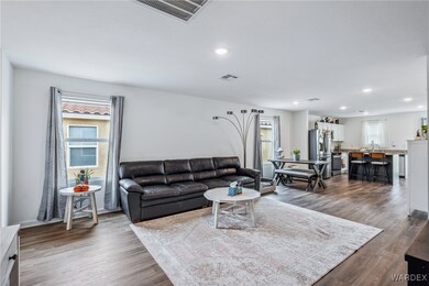 Living room with recessed lighting, dark wood-styl