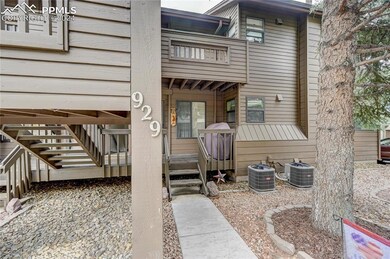Doorway to property with central AC unit