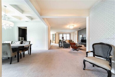Open concept floor plan connecting siting, dining 