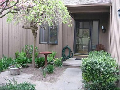 Exterior Front LOVELY PLANTINGS AS YOU GO THROUGH 