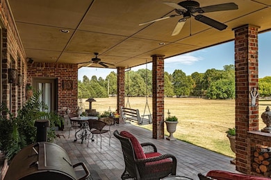 View of patio with ceiling fan