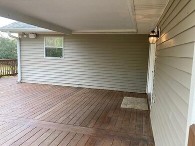 Deck upstairs leading to front door