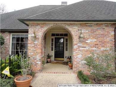 Next to the front porch is a landscaped and wrough