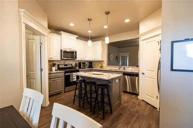 Kitchen featuring appliances with stainless steel 