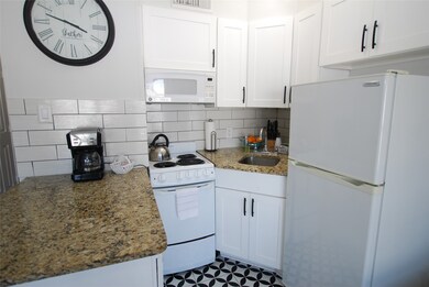 Kitchen is compact and efficient.