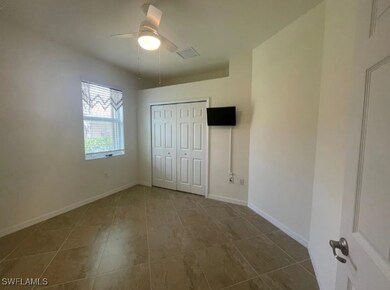 Unfurnished bedroom featuring a closet, baseboards