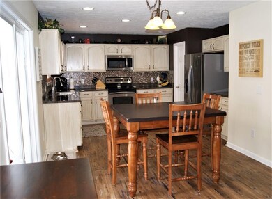 Eat-in kitchen has plenty of room along with a huge walk-in pantry!
