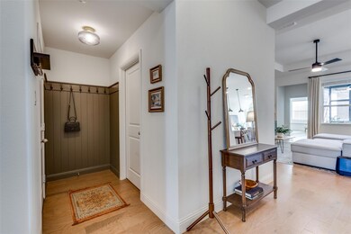 Mudroom with light wood-style floors, paneling, an