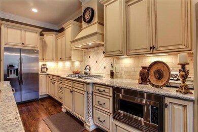 SS appliances include: 5 burner Gas range w/ simmer and High BTU burners , a vented hood,   DBL ovens, DW,Microwave, & refrigde.  You'll appreciate the under cabinet lighting, vertical spice rack, & recessed lites too! 12x10 Breakfast room not shown.