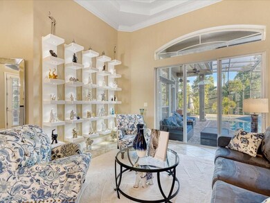 Formal living room; custom built lighted shelving 