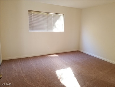 Unfurnished room with carpet flooring and baseboards
