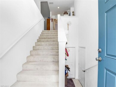 Staircase with tile patterned floors