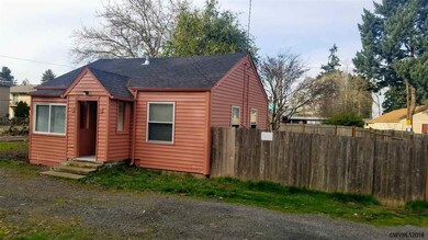 NE corner front with fenced side yard.
