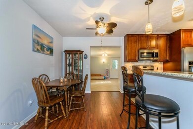 DINING AREA AND KITCHEN TO BONUS ROOM