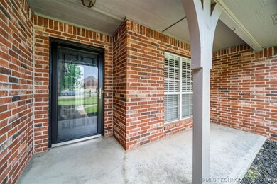 Covered porch is ready for sitting and sipping cof