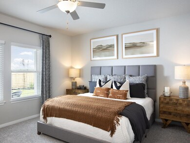 Carpeted bedroom featuring baseboards and ceiling