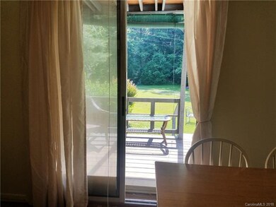 Sliding Glass door to the Deck off of the Kitchen in Large White Home 5BR/3BA