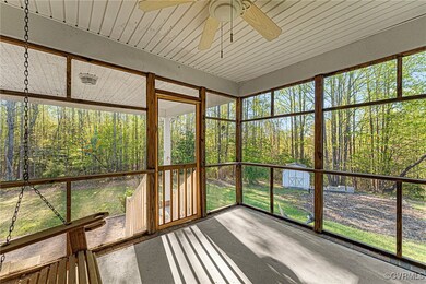 Sweet screen porch on rear of home. Just a picnic