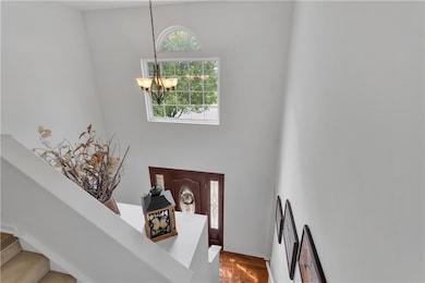 Grand two-story foyer that sets a welcoming tone.